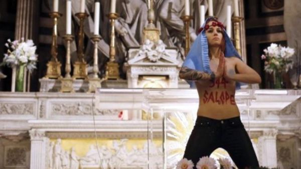 Femen protestors also targeted France and Spain along with the Vatican during Christmas celebrations (Thomas Samson/AFP)