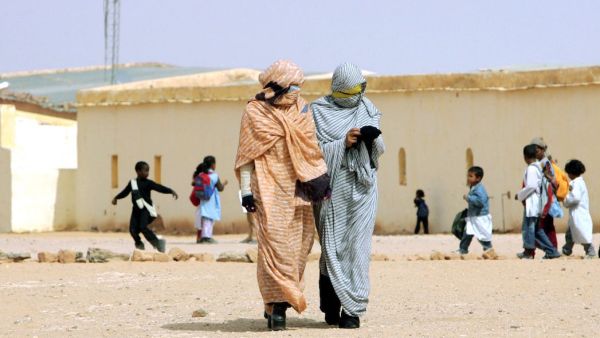Refugees from Western Sahara walk through a school in a refugee camp in the Tindouf reigon. (AFP/File)