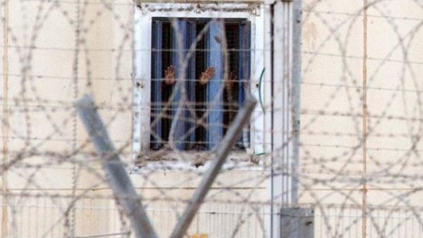 A glimpse past the fence of Nafha prison. (AFP/File)