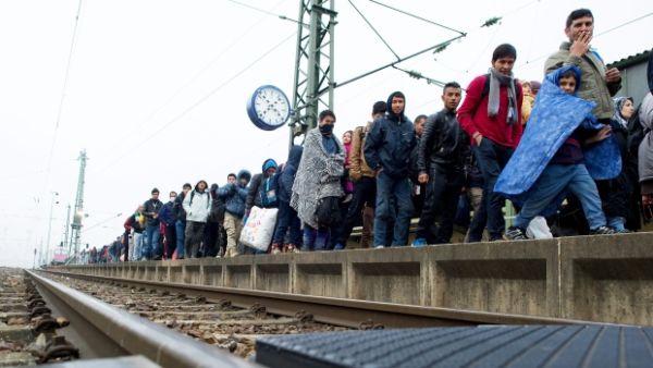 Migrants make their way to board a train to Duesseldorf, Germany in Passau. (AFP/File)