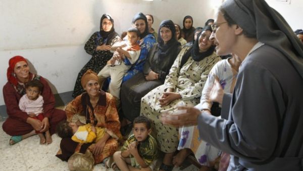Egyptian women attend a lecture on female genital mutilation in Beni Suef. (Cris Bouroncle/AFP/Getty Images)