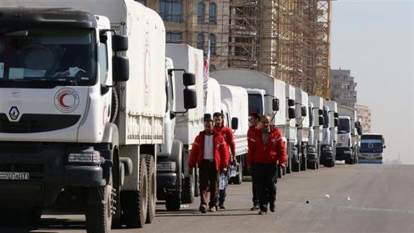 A Red Crescent convoy prepares to leave the Syrian capital Damascus to the besieged areas of Aleppo. (AFP/File)