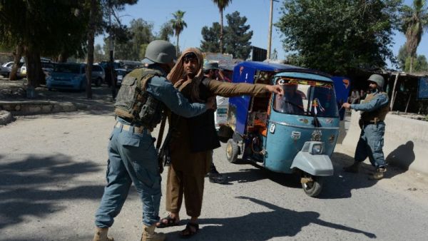 Afghan police search vehicles in Jalalabad, on April 29, 2016. (AFP/File)