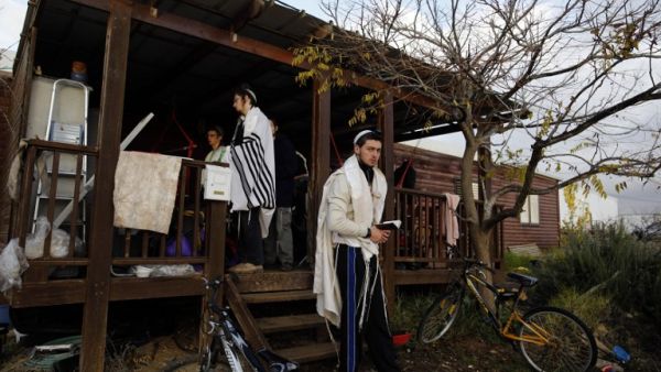 Each evacuated Amona family to get 1 million shekel payout. (AFP/File)