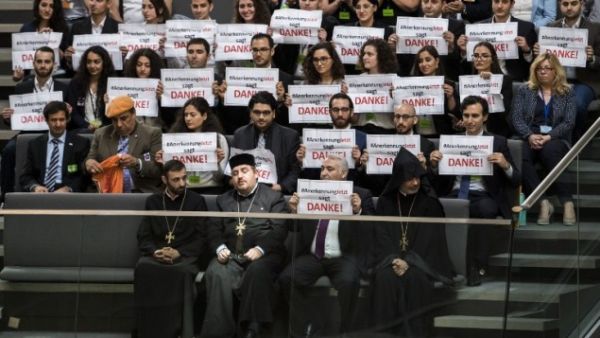 Armenian clergy men and activists react after lawmakers voted to recognize the Armenian genocide. (AFP/File)