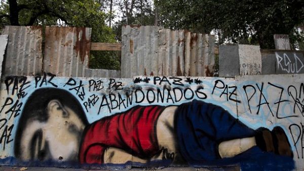 A graffiti depicting Aylan Kurdi, a 3-year-old Syrian boy drowned off a beach in Turkey, seen in Sorocaba, some 90km from Sao Paulo, Brazil. (AFP/File)