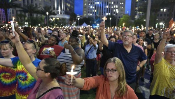 Huge crowds attend a candlelit vigil in Orlando for the victims of the Pulse nightclub shooting. (AFP/File)