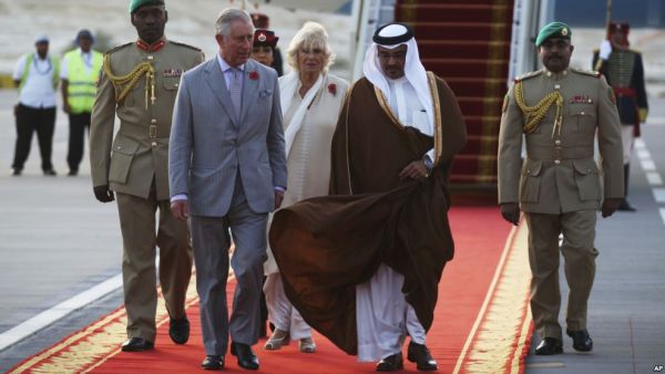 Britain's Prince Charles speaks to Bahrain's Crown Prince Salman bin Hamad bin Isa Al Khalifa upon arriving in Manama, Bahrain, Nov. 8, 2016. Prince Charles and his wife Camilla, seen behind the two princes, are on a three-nation tour of the Gulf. (AFP/File)
