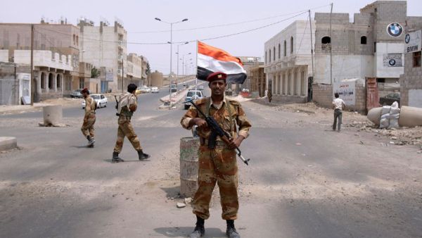 A Yemeni army officer looks on while standing at a checkpoint in Sanaa, Yemen. (AFP/File)