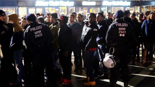 German police monitor people during New Year celebrations at the main train station in Cologne. (AFP/File)