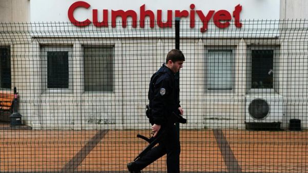 Police man walks by Cumhuriyet daily agency, the media outlet for Erdogan's main political opposition. (AFP/File)