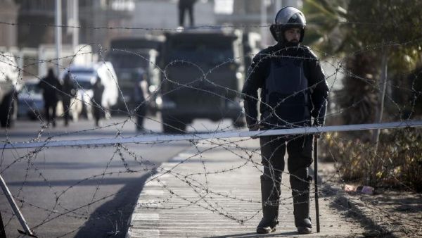 Illustrative photo of Egyptian riot police stand guard in Cairo, January 28, 2014. (AFP/Mahmoud Khaled)