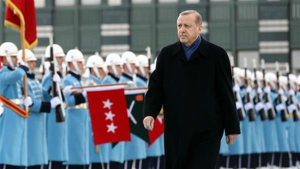 Turkish President Recep Tayyip Erdogan walks past an honor guard, in the capital, Ankara. (AFP/File)
