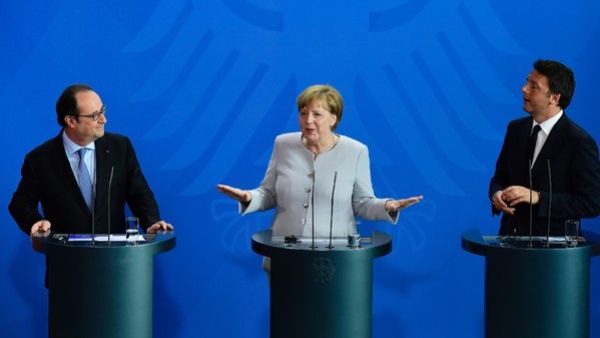 French President François Hollande, German Chancellor Angela Merkel and Italy's Prime Minister Matteo Renzi. (AFP/File)