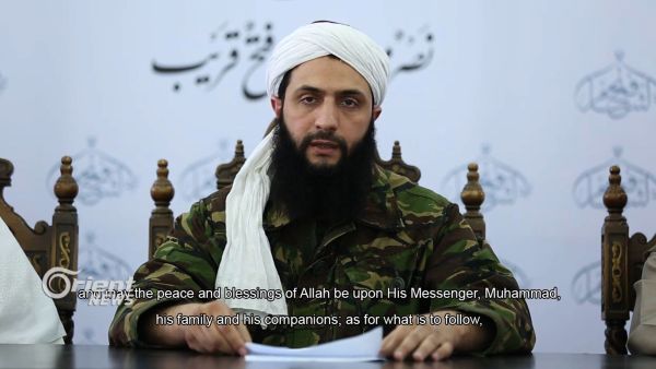 An image grab taken from a video broadcast Thursday by Dubai-based Orient News satellite television shows the head of Nusra Front in Syria, Abu Mohamad al-Jolani, giving a speech from an undisclosed location, in the first-ever video showing his face to be released. Jolani said his group was breaking ties with al-Qaida and changing its Arabic name to Jabhat Fateh al-Sham (Conquest of Syria). (Courtesy photo)
