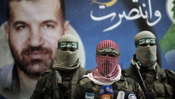 Members of the Ezzedine al-Qassam Brigades, the armed wing of Hamas, address a press conference in Gaza City on 22 November 2012. (Twitter)