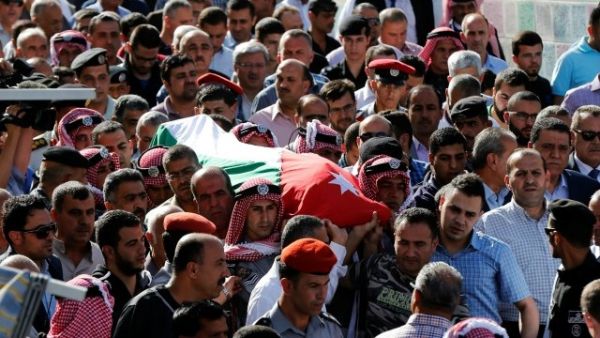 Jordanian mourners carry the body of intelligence corporal Omar al-Hayari, one of the five men killed in the attack. (AFP/File)