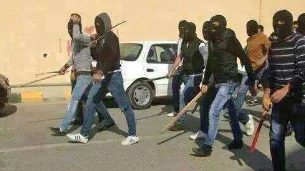 Masked men carrying swords and bats. (File photo)