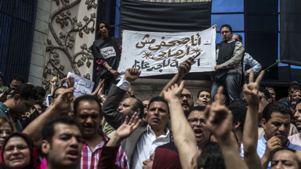 Journalists hold a banner reading in Arabic: "I am a journalist not a terrorist". (AFP/File) Journalists hold a banner reading in Arabic: "I am a journalist not a terrorist". (AFP/File)