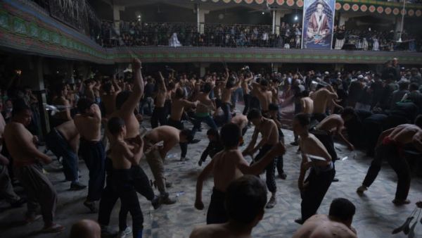 Afghan Shia Muslims conduct self-flagellation rituals as part of the Ashura commemorations at a Kabul mosque on October 9, 2016. (AFP/Shah Marai)