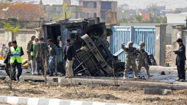 Afghanistan's security force and rescue personnel and NATO troops inspect the site of a suicide attack. (AFP/File)