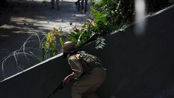 An Indian policeman prepares to fire a pellet gun towards Kashmiri protestors during clashes in Srinagar on July 29, 2016. (AFP/File)