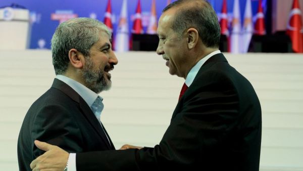 Turkey's Prime Minister Recep Tayyip Erdogan, right, and Palestinian Hamas leader Khaled Meshaal. (AFP/File)