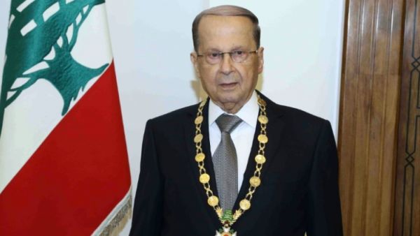 Lebanese President Michel Aoun posing with the presidential medal at the presidential palace of Baabda. (AFP/File)