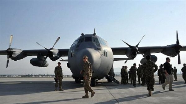 This file photo shows American soldiers close to a C-130 Hercules military transport plane. (AFP/File)
