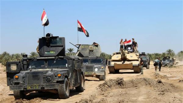 Iraqi Counter Terrorism Forces drive their armored vehicles after they retook an area from Daesh on April 2, 2016 in the village of Al-Mamoura, near Hit, Anbar Province. (AFP/File)
