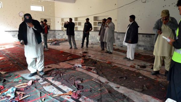 Pakistani security officials gather at a Shiite Muslim mosque after a bomb explosion in Shikarpur. (AFP/File)