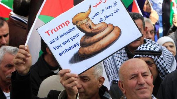 The activity included hanging up pictures of Trump with slogans rejecting his views which many have called divisive and racist. As activists began burning images of Trump, Israeli forces quickly arrived and attempted to expel them from the area, while threatening to use force on the activists. (AFP/File)