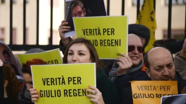 People hold placards reading 'Truth about Giulio Regeni ', an Italian student who was found dead in Egypt, bearing signs of torture. (AFP/Filippo Monteforte)