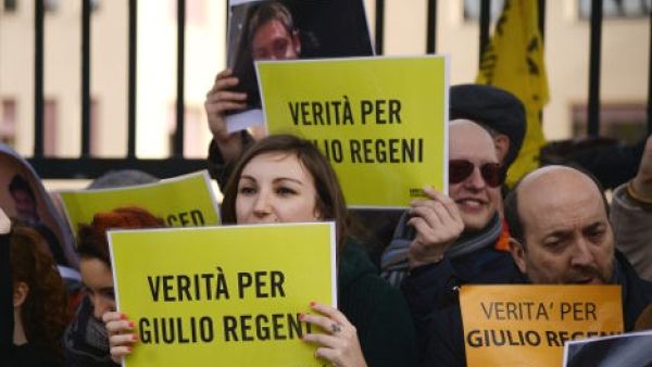 People hold placards reading 'Truth about Giulio Regeni ', an Italian student who was found dead in Egypt, bearing signs of torture. (AFP/Filippo Monteforte)