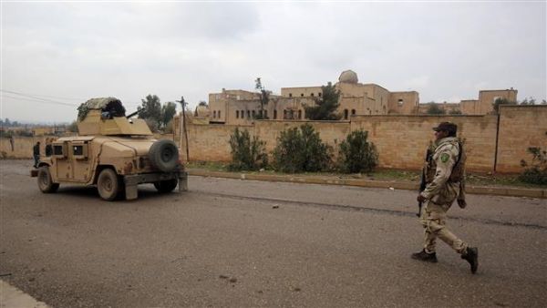 Iraqi soldiers patrol a street on January 22, 2017 next to a church on the northern outskirt of Mosul, which was destroyed by Daesh militants. (AFP/File)