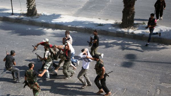 Fighters take to the streets of Aleppo. (AFP/File)
