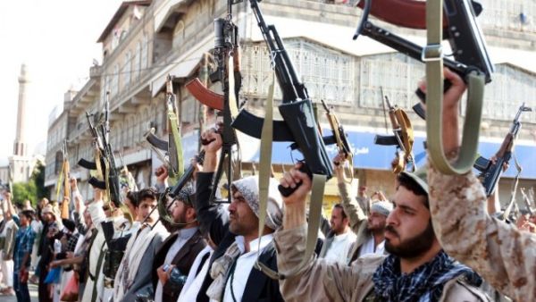 Tribal gunmen loyal to the Houthi movement brandish their weapons in the capital Sanaa. (AFP/File) 