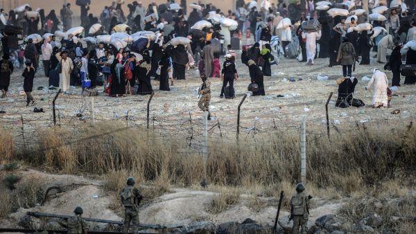 Turkish troops and Daesh militants stared at each other just a few yards apart across the barbed wire border as the civilians retreated. (AFP/File)