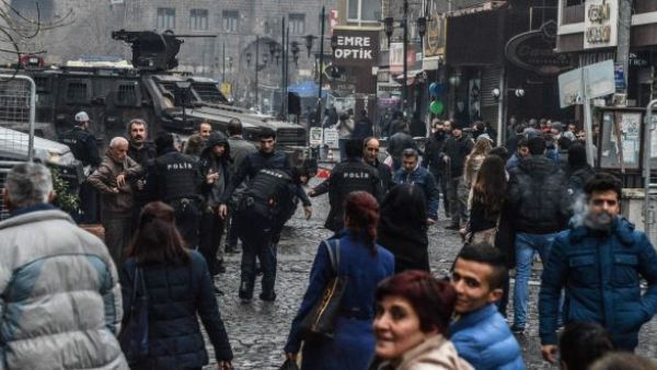 Turkish police performing body checks on people in the street following the New Year bombing. (AFP/File)