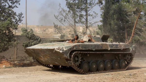 Nusra Front fighters south of Aleppo. They now go by the name Jabhat Fatah al-Sham (AFP/Omar Haj Kadour)