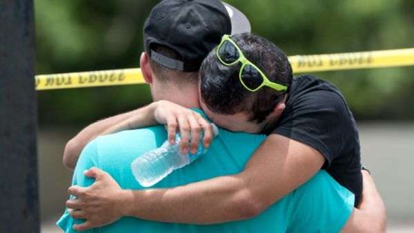 A man weeps at the scene of the Pulse nightclub shooting in Orlando (Gregg Newton/AFP)
