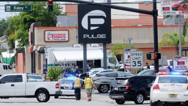 Police officers outside the Pulse nightclub where Omar Mateen opened fire and took hostages on Sunday, June 12. (AFP/Gerardo Mora)