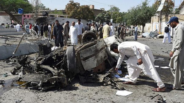 Pakistani security officials inspect the site of a powerful explosion that targeted a police vehicle in Quetta on June 23, 2017. (AFP)
