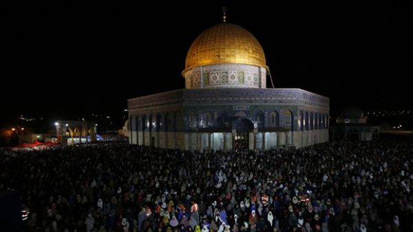 Palestinian Muslim worshippers pray overnight outside the Dome of the Rock in the Al-Aqsa mosques compound in Jerusalem's Old City on the occasion of Laylat al-Qadr. (AFP/File)