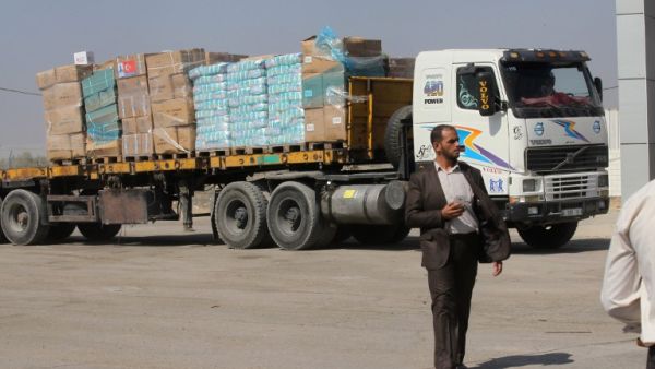 A truck loaded with aid parcels provided by Turkey waits at the Kerem Shalom crossing near Rafah after entering the southern Gaza Strip from Israel on July 4, 2016. (AFP/Said Khatib)