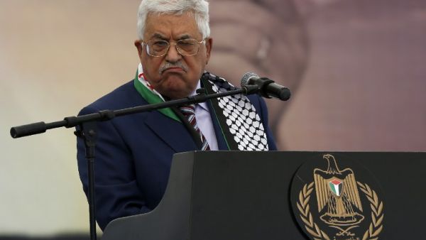 Palestinian president Mahmud Abbas gestures as he gives a speech during a rally marking the 12th anniversary of the death of late Palestinian leader Yasser Arafat in the West Bank city of Ramallah on November 10, 2016. (AFP/Abbas Momani