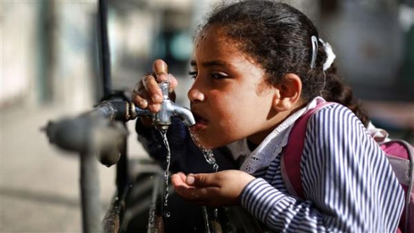 A file photo of a Palestinian child drinking water from a working faucet in Gaza Strip amid a severe water shortage in the besieged territory. (AFP/File)