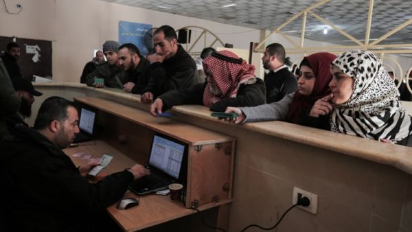 Palestinians wait for travel permits to cross into Egypt through the Rafah border crossing after it was opened by Egyptian authorities for humanitarian cases, in Rafah in the southern Gaza Strip December 10, 2016. (AFP/Said Khatib)