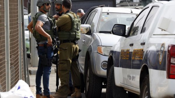 Israeli security forces gather at the site of a reported attack. (Jack GUEZ / AFP)