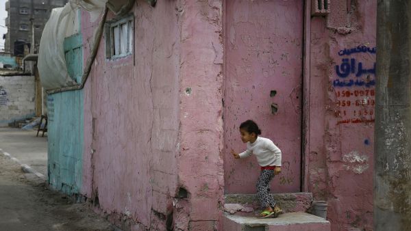 A Palestinian girl plays by her house in Gaza. (AFP/Mohammed Abed)